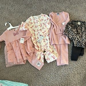 12-18 month clothes from various stores. Brand new tags still on all 3 outfits.
